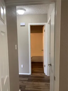 a view of a livingroom from a hallway