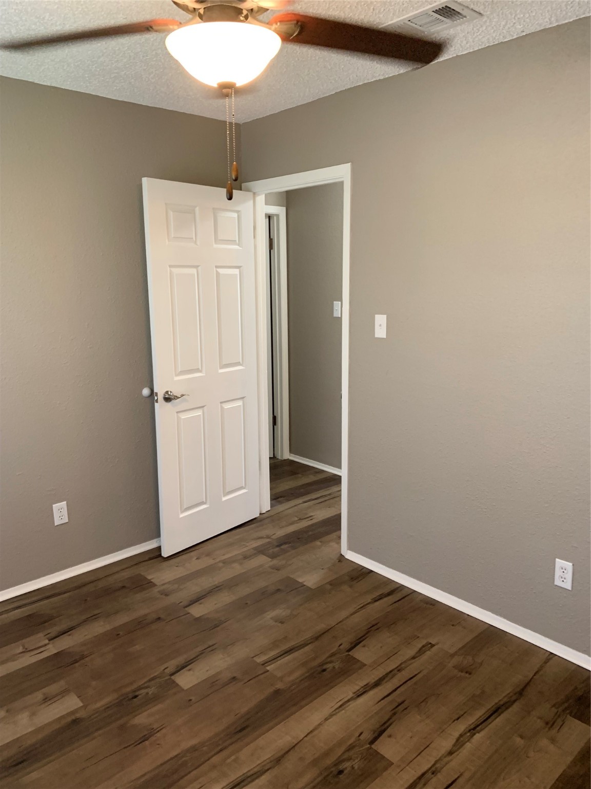 1601 Meadowview Drive Port Lavaca, TX 77979 - Photo 10 of 38 a view of an empty room with wooden floor