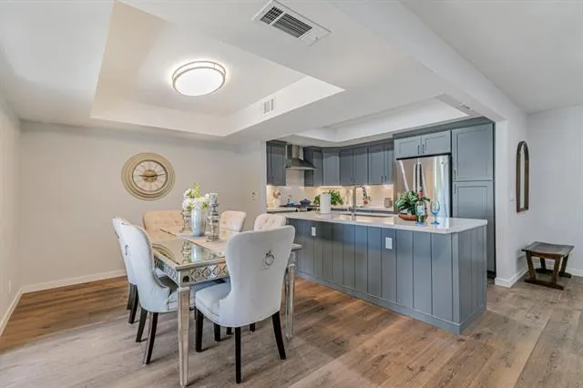 a dining room with furniture and window