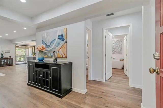 a bathroom with a bathtub and shower