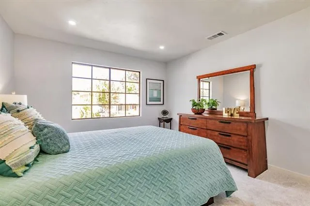 a view of a car parked front of a house