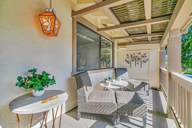 a view of a garden with sitting area