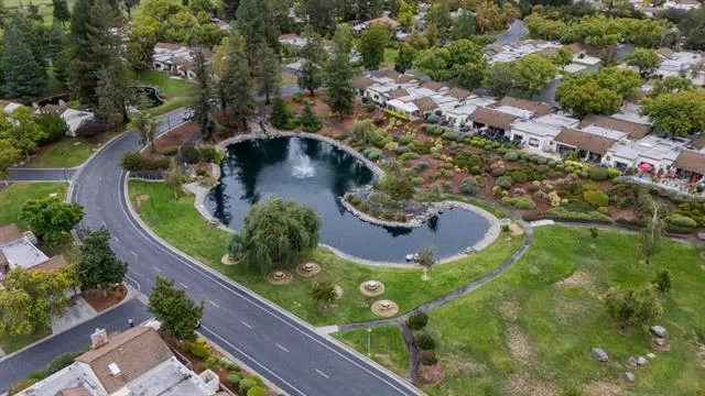 a view of a lake with houses with outdoor space