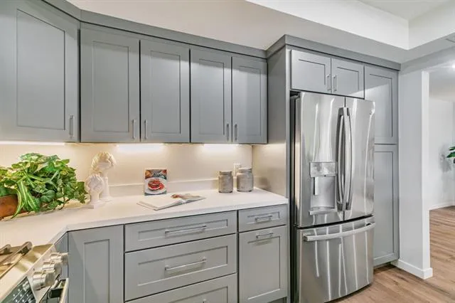 a kitchen with appliances and cabinets