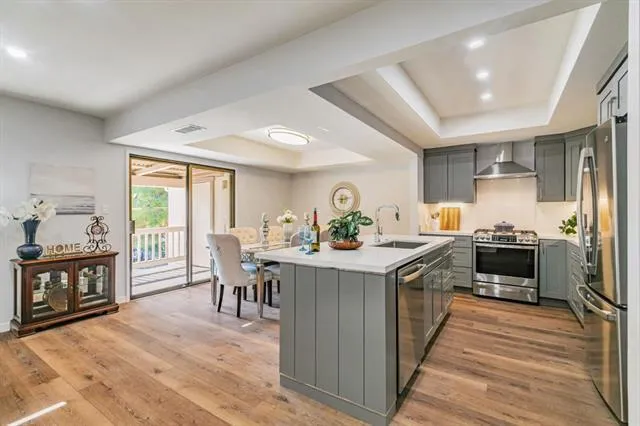a kitchen with a stove and a refrigerator