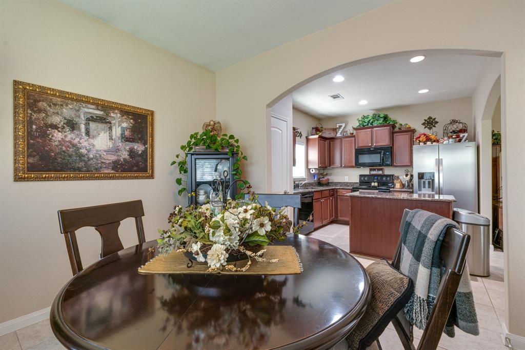 1853 Olive Lane Anna, TX 75409 - Photo 9 of 23 Dining space with light tile patterned floors, arched walkways, and recessed lighting