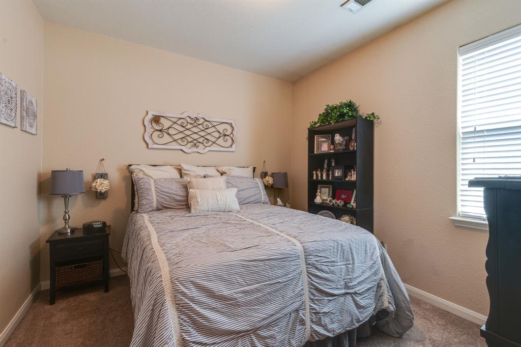 1853 Olive Lane Anna, TX 75409 - Photo 6 of 23 Carpeted bedroom featuring baseboards and a textured wall