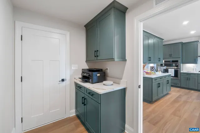 a kitchen with a stove and a sink