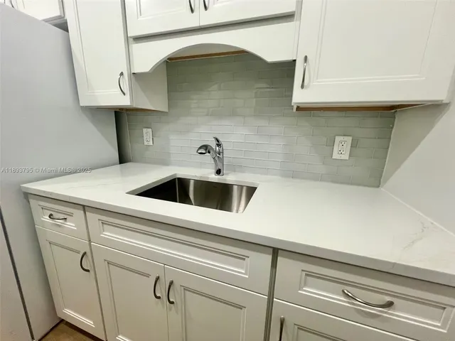 a view of a bathroom with mirror