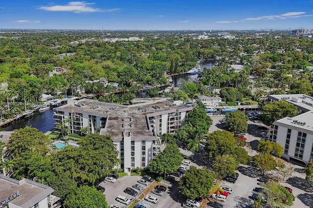 a view of a lake with a table and chairs