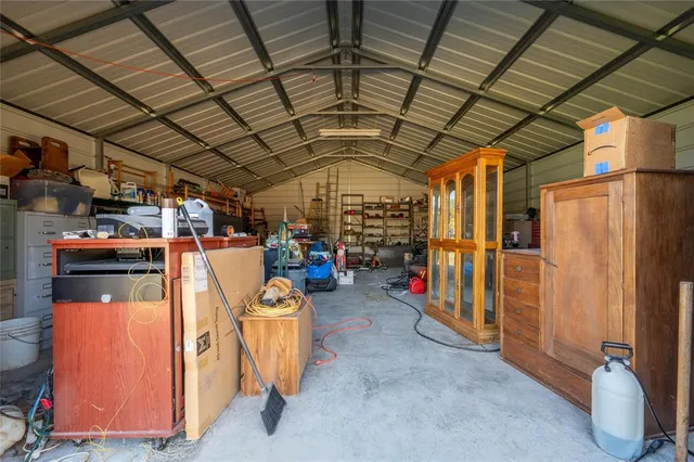 a view of gym with large windows