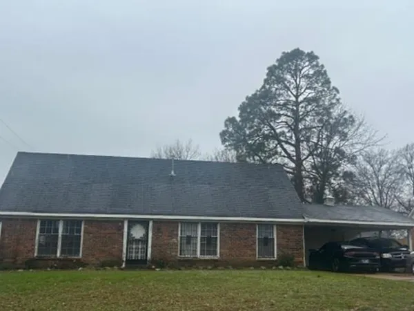 front view of a house with a yard