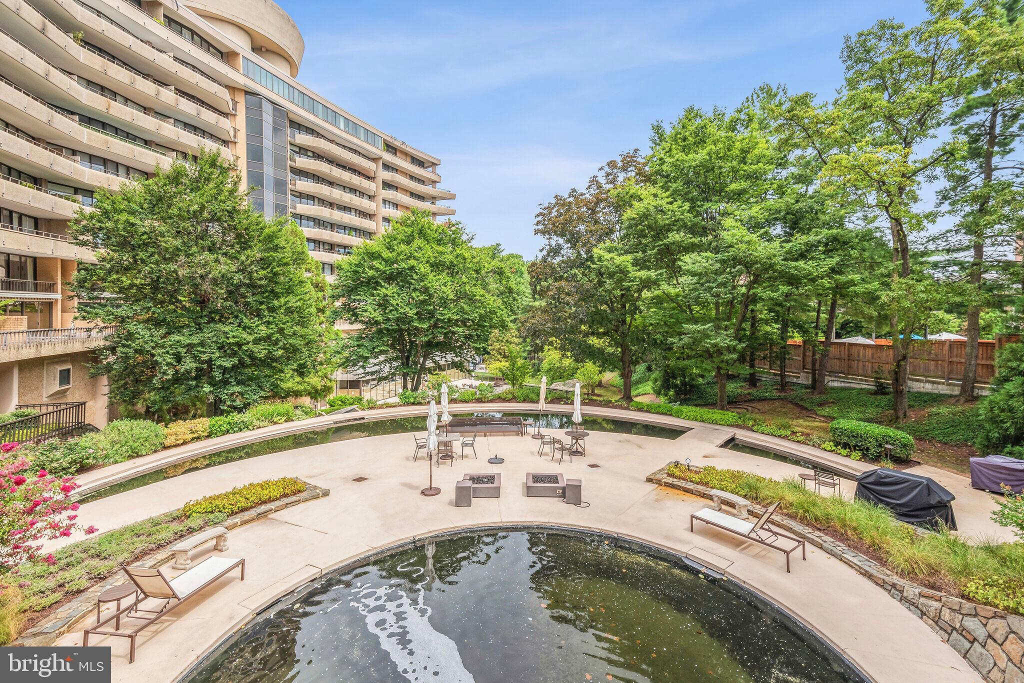 4200 Massachusetts Avenue Northwest, Unit 106 Washington, DC 20016 - Photo 2 of 48 a view of a swimming pool with a patio
