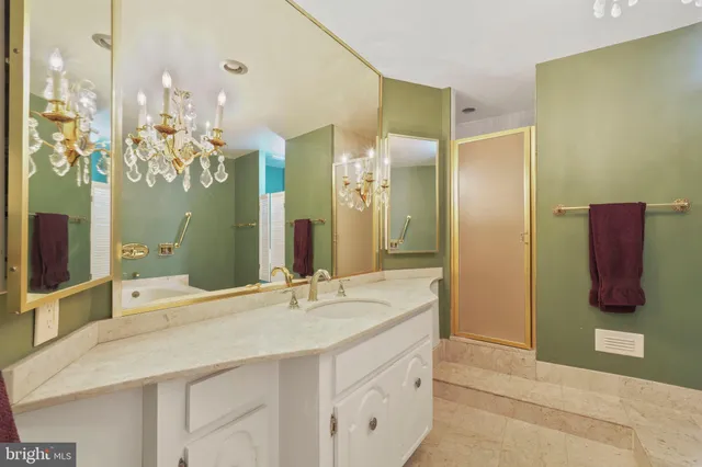 a bathroom with a sink vanity and a mirror