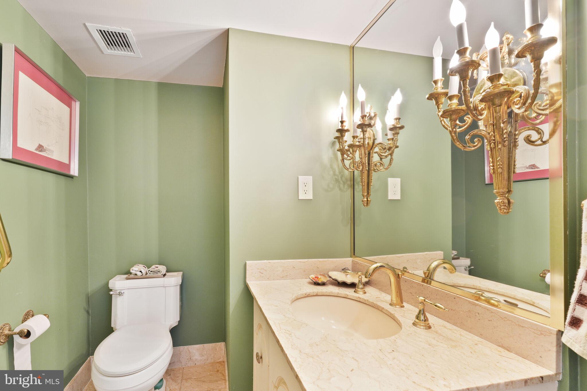 4200 Massachusetts Avenue Northwest, Unit 106 Washington, DC 20016 - Photo 25 of 48 a bathroom with a granite countertop sink and a mirror