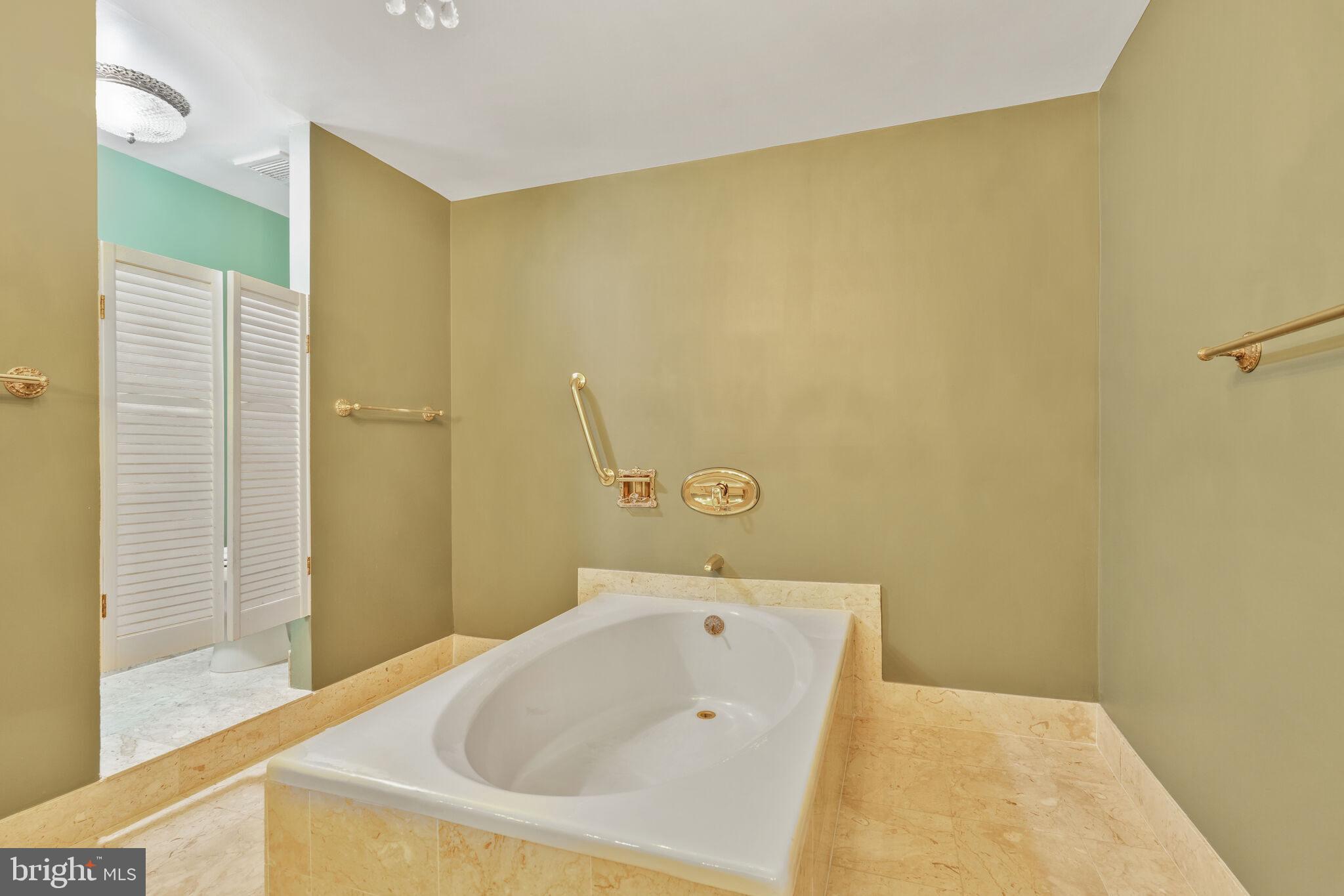 4200 Massachusetts Avenue Northwest, Unit 106 Washington, DC 20016 - Photo 26 of 48 a bathroom with a tub and shower
