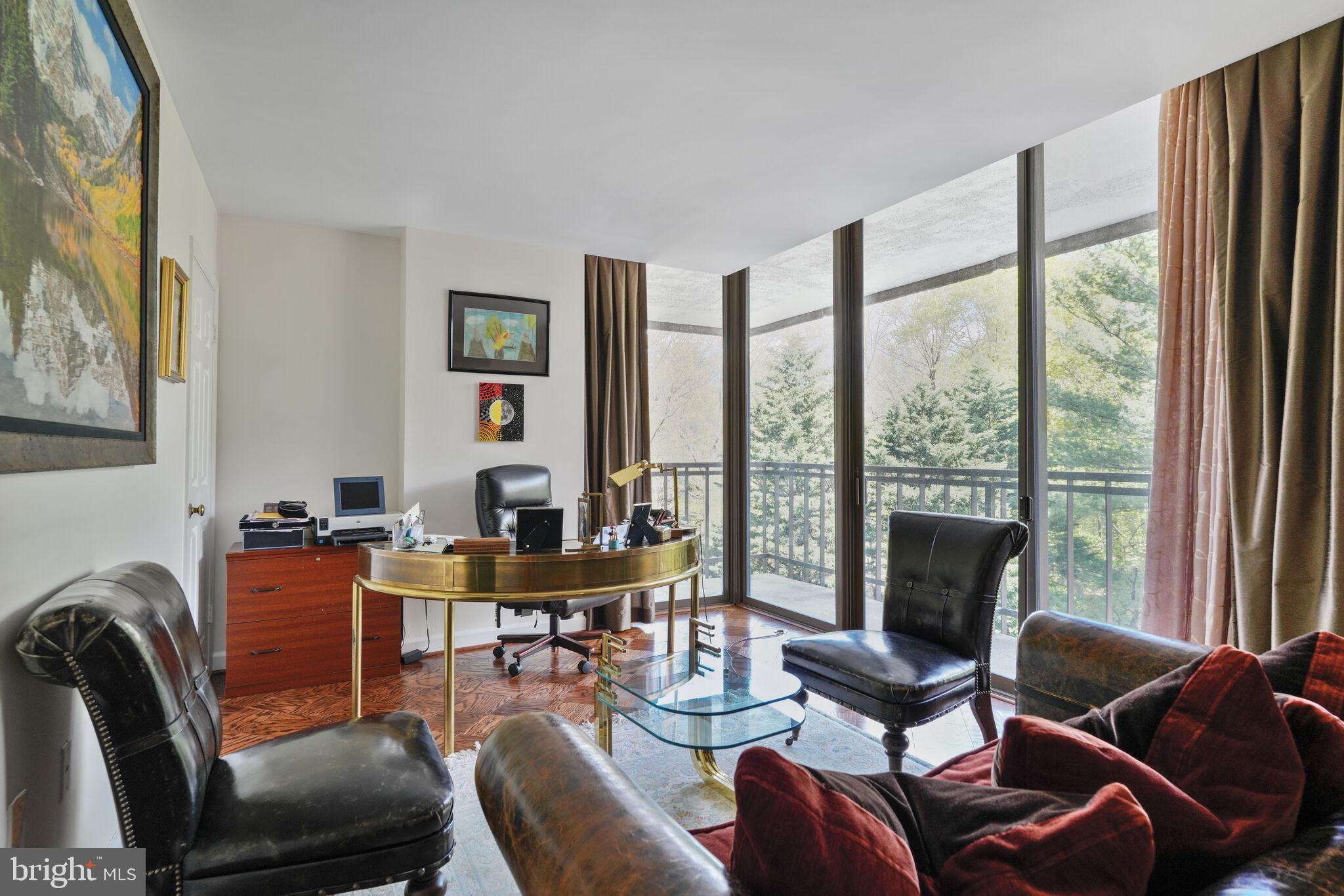 4200 Massachusetts Avenue Northwest, Unit 106 Washington, DC 20016 - Photo 27 of 48 a work room with furniture and floor to ceiling windows