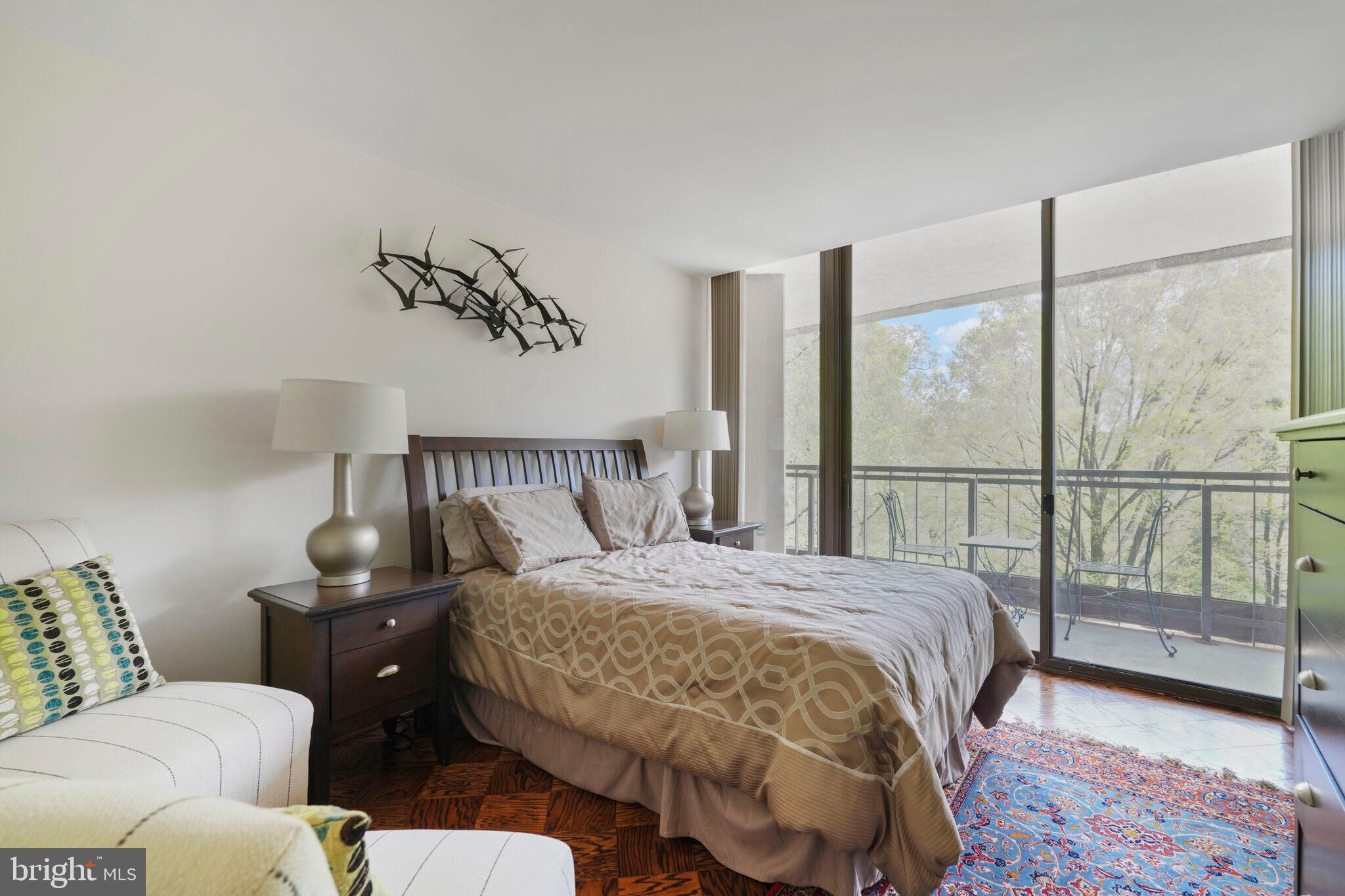 4200 Massachusetts Avenue Northwest, Unit 106 Washington, DC 20016 - Photo 31 of 48 a bedroom with a bed and glass window