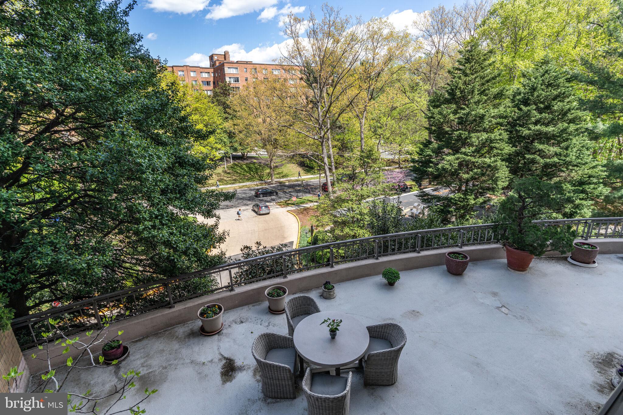 4200 Massachusetts Avenue Northwest, Unit 106 Washington, DC 20016 - Photo 35 of 48 a view of a pool table and chairs in the patio