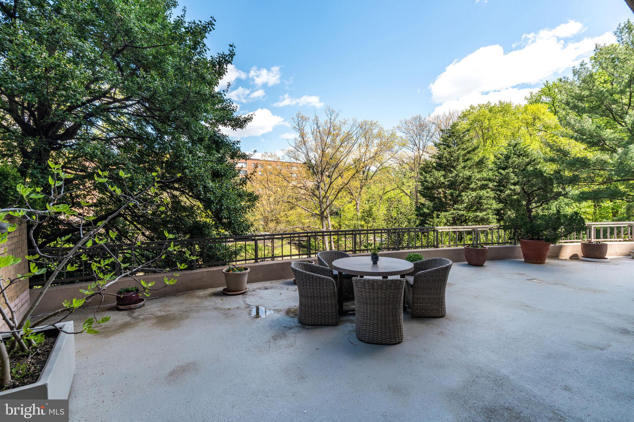 4200 Massachusetts Avenue Northwest, Unit 106 Washington, DC 20016 - Photo 37 of 48 a view of a patio with a table and chairs