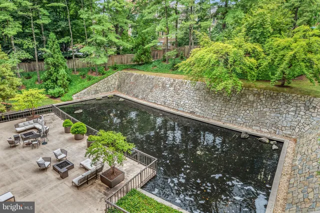 a view of a backyard with sitting area
