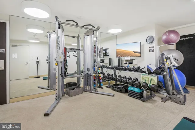 a bedroom with bed and a chandelier