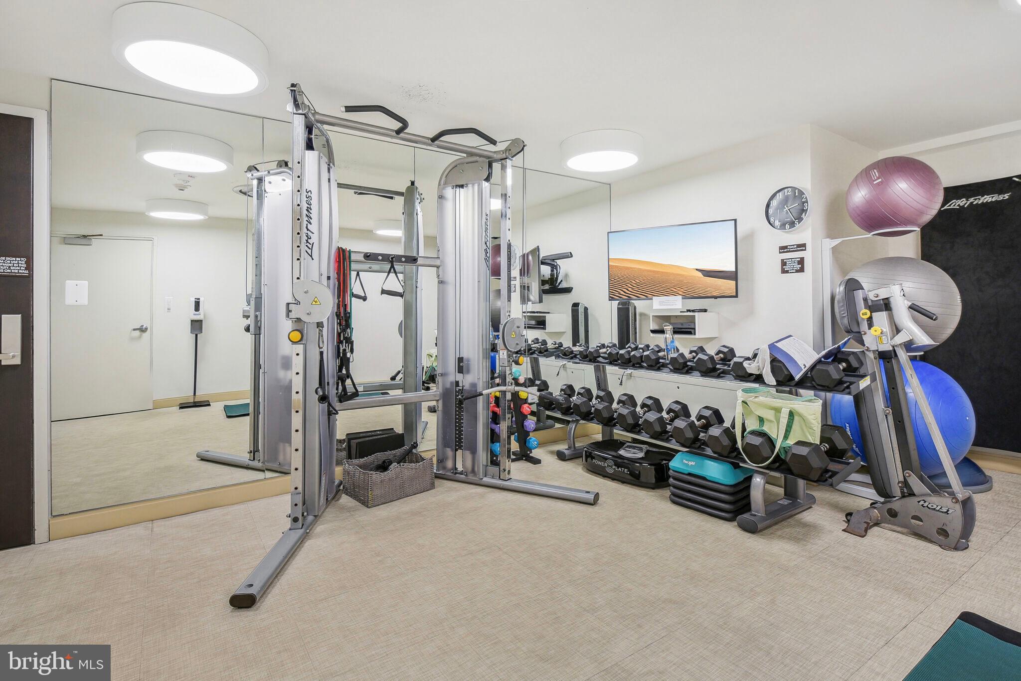 4200 Massachusetts Avenue Northwest, Unit 106 Washington, DC 20016 - Photo 43 of 48 a bedroom with bed and a chandelier