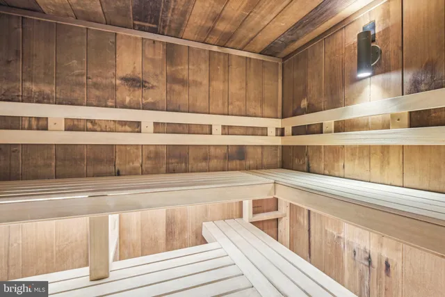 a view of a kitchen with wooden floor and a window