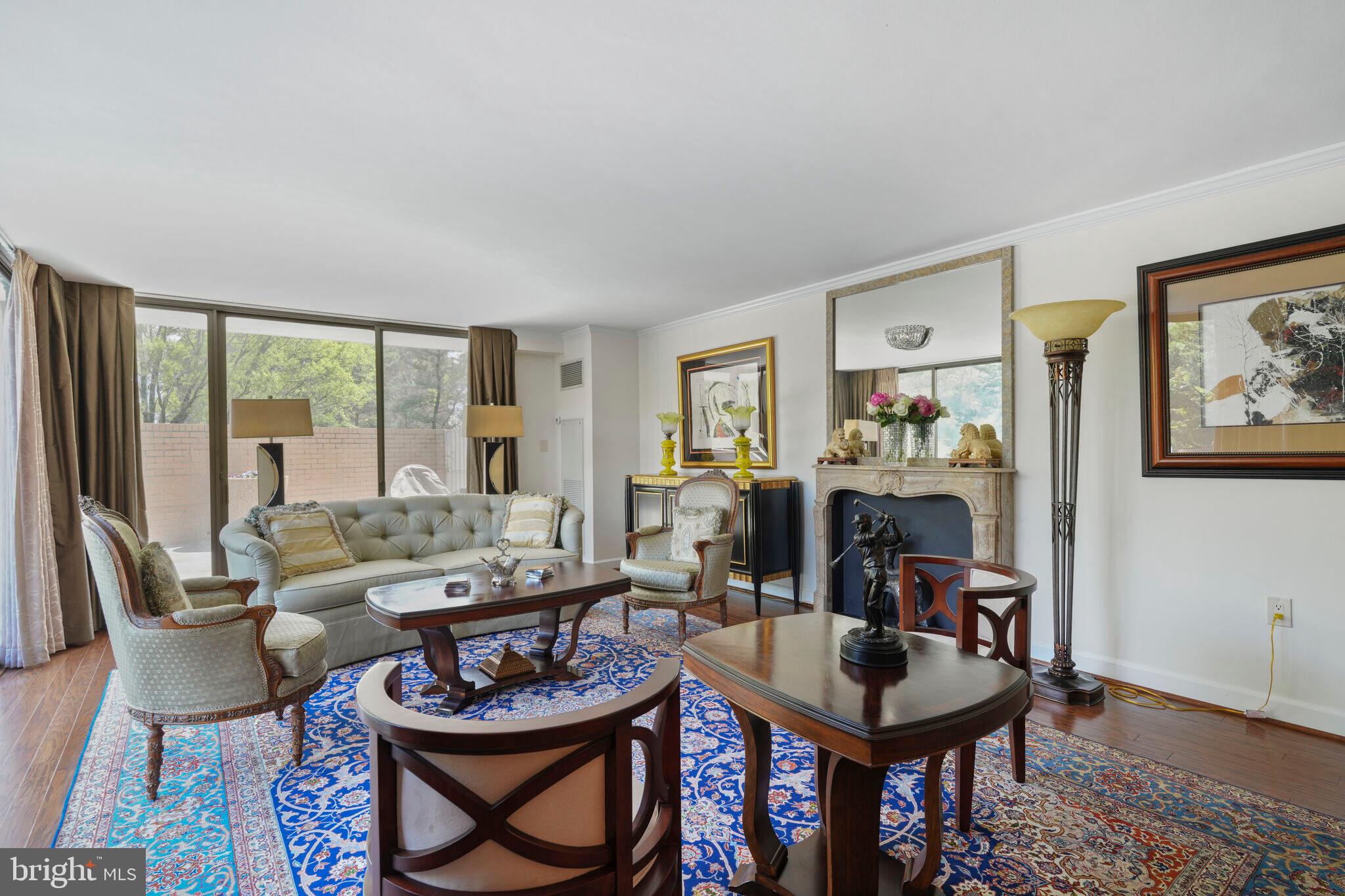 4200 Massachusetts Avenue Northwest, Unit 106 Washington, DC 20016 - Photo 7 of 48 a living room with furniture and a fireplace