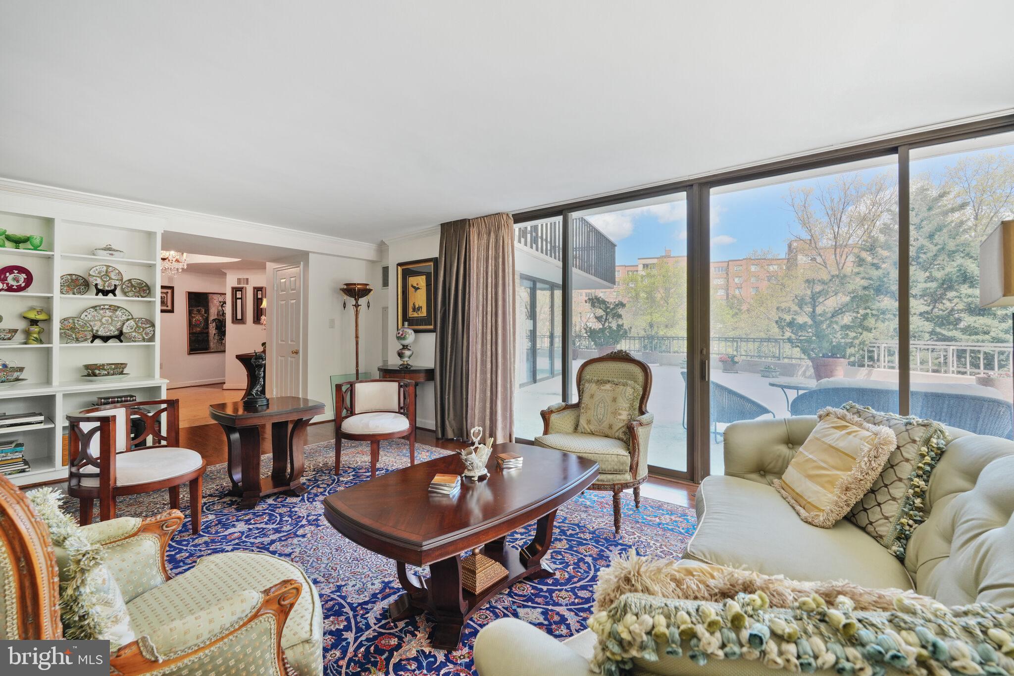 4200 Massachusetts Avenue Northwest, Unit 106 Washington, DC 20016 - Photo 8 of 48 a living room with furniture and a large window