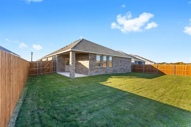 a view of a backyard of the house