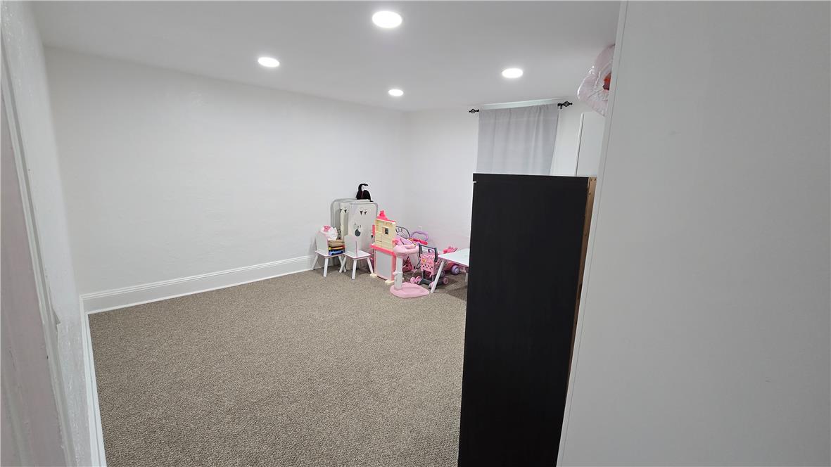 883 North Locust Street Hazleton, PA 18201 - Photo 47 of 83 Recessed lighting illuminates this versatile room, offering a cozy retreat or dynamic play space.