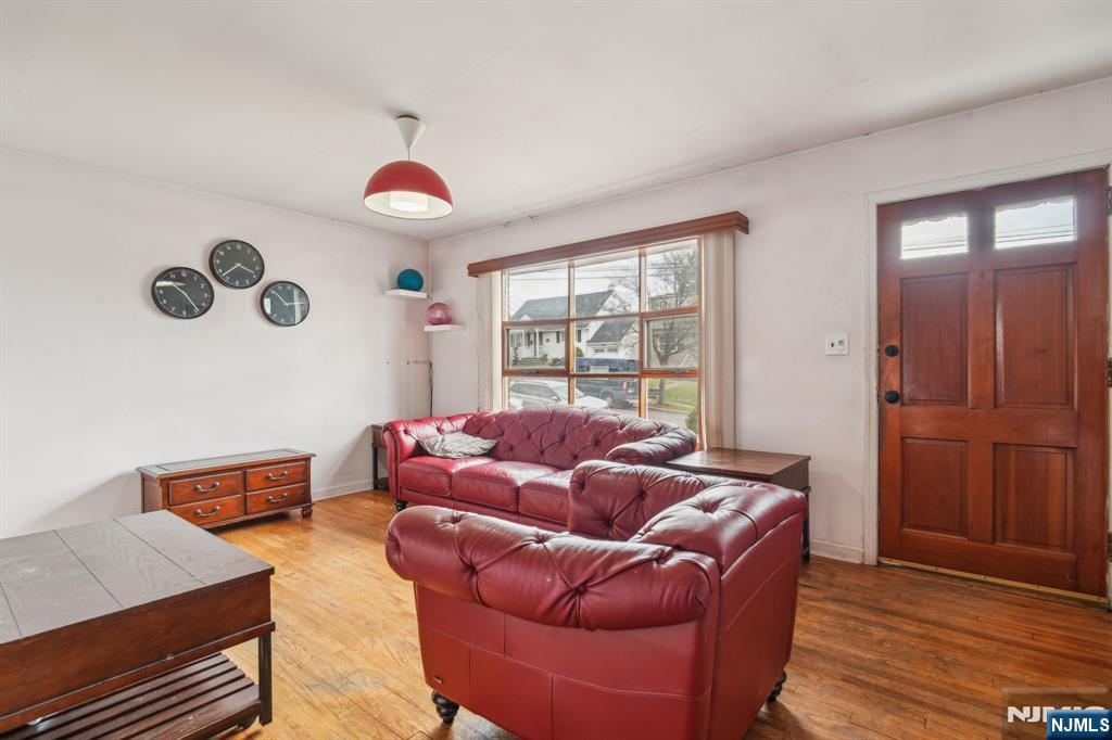 163 Kent Street Hackensack, NJ 07601 - Photo 5 of 19 a living room with furniture and a window