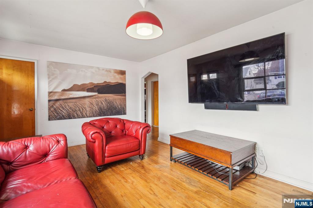 163 Kent Street Hackensack, NJ 07601 - Photo 6 of 19 a living room with furniture and wooden floor
