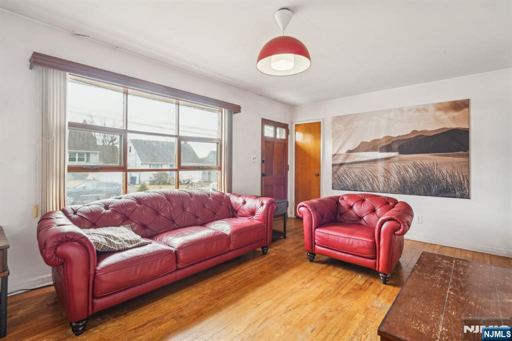 163 Kent Street Hackensack, NJ 07601 - Photo 7 of 19 a living room with furniture and a large window