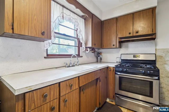 a kitchen with a stove and a sink
