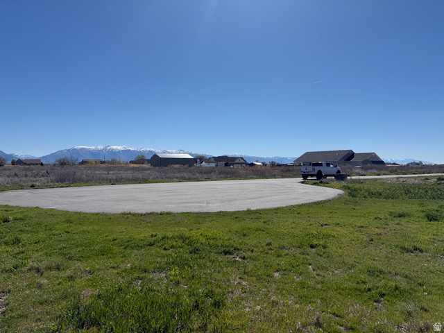 5752 West 2425th North, Unit 4 Hooper, UT 84315 - Photo 17 of 20 View of yard with a mountain view