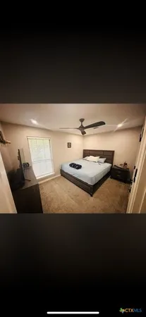 a bathroom with a sink and a shower curtain