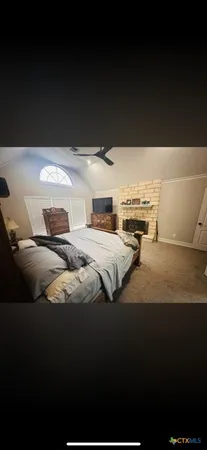a living room with furniture window and wooden floor