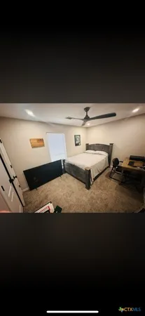 a view of a hallway with wooden floor and closet