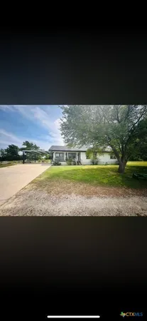 a kitchen with stainless steel appliances a stove a sink and a refrigerator
