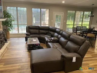 a living room with furniture and a large window