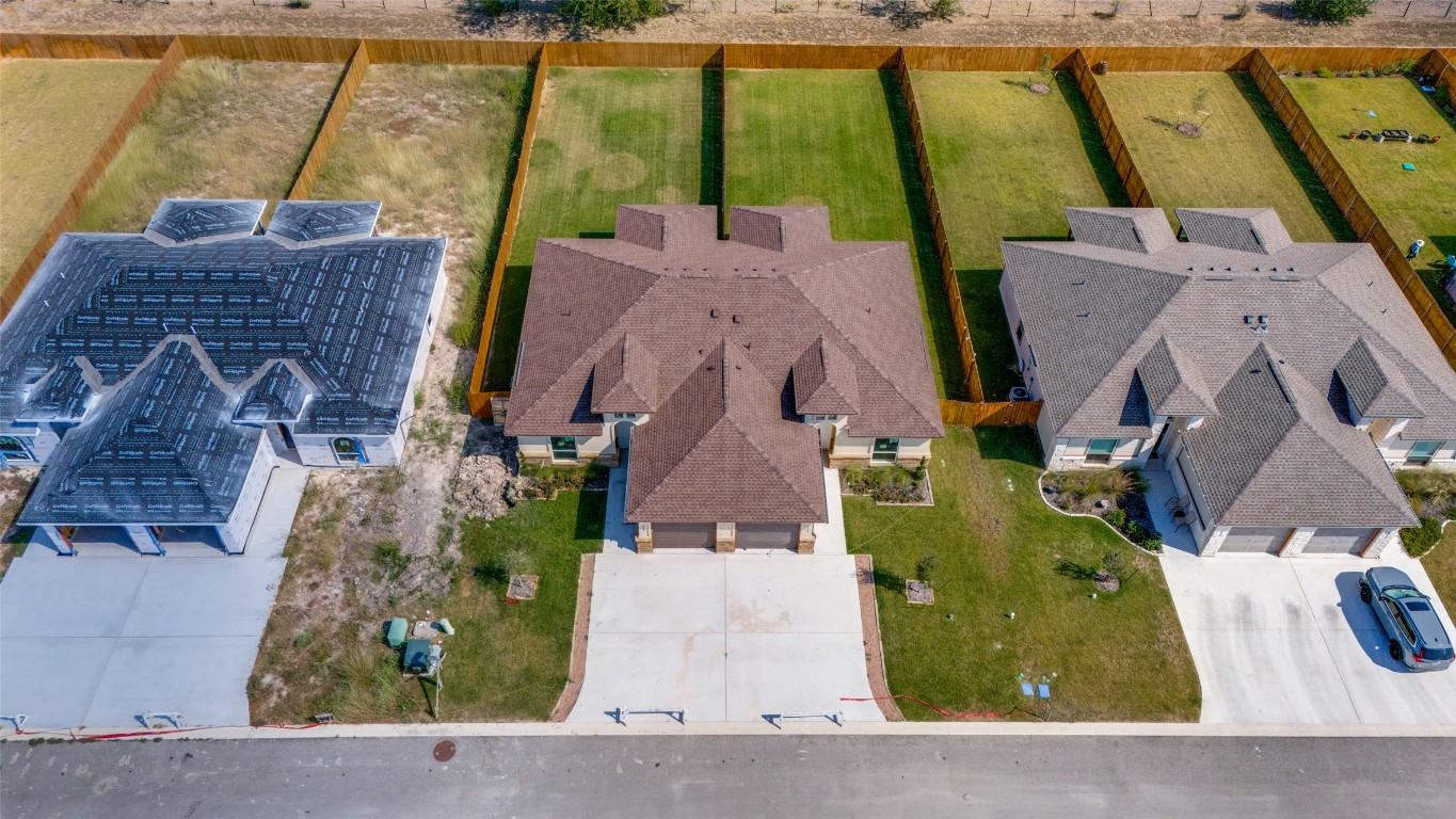 an aerial view of a house with a swimming pool