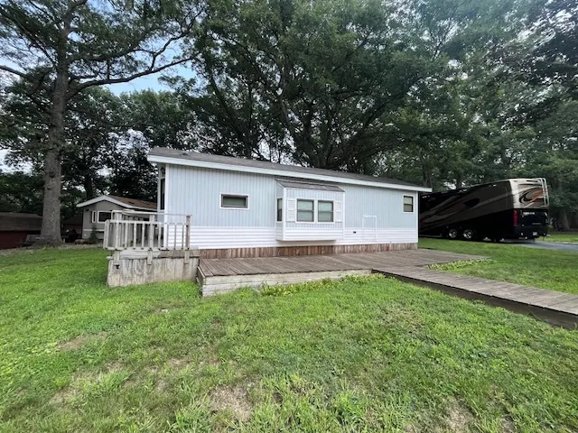 a front view of house with yard and seating area