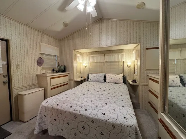 a kitchen with a refrigerator and a sink