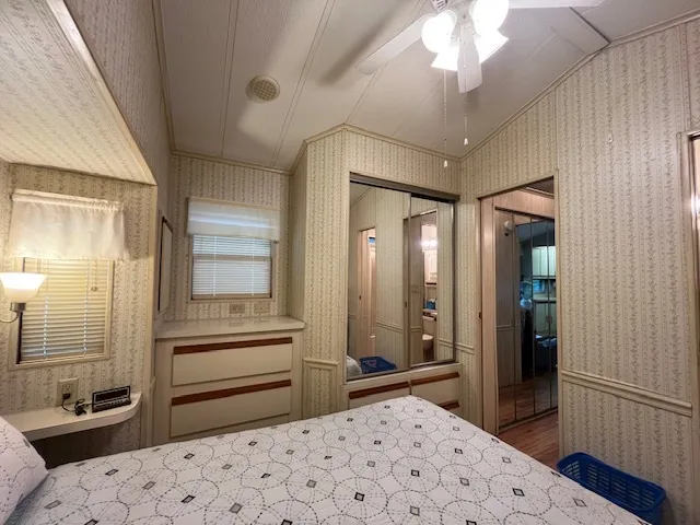 a bedroom with a bed and a view of bathroom