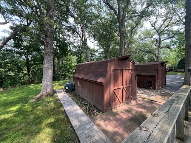 a view of outdoor space with trees all around