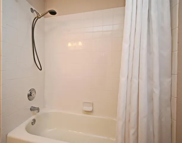 a bathroom with a bath tub and a shower