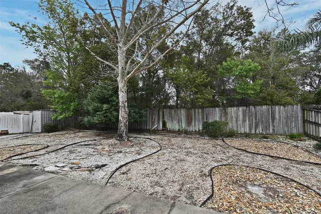a backyard of a house with lots of green space
