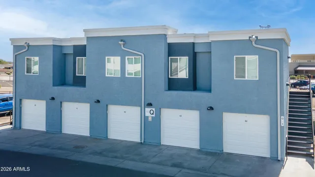 a living room with furniture potted plant and a window